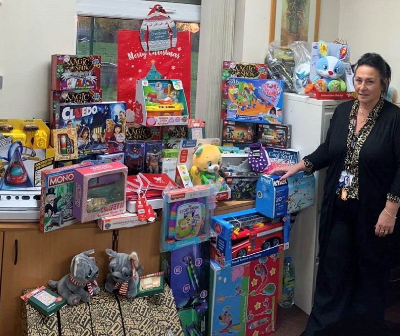 Liz Heague with the presents received from Cash for Kids - Mission Christmas