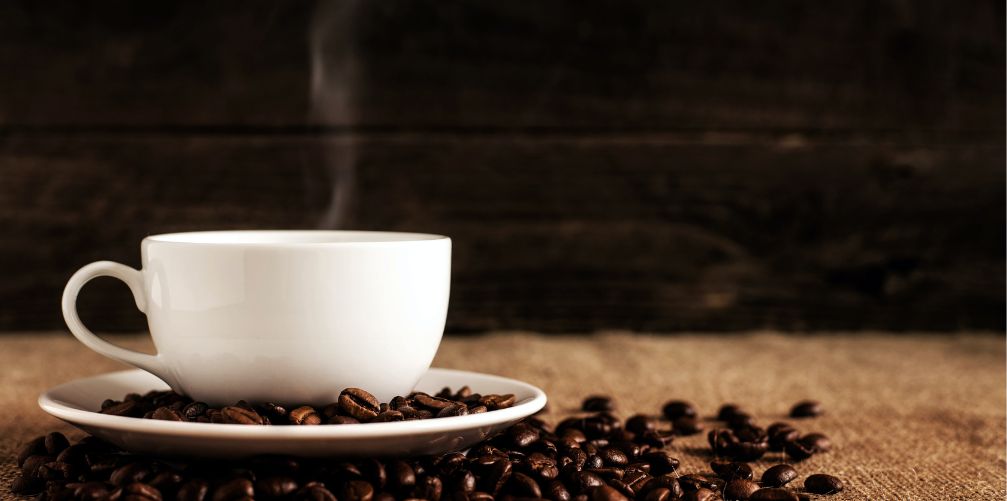 cup of coffee and beans on a saucer